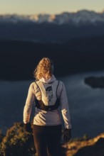 Trail running in autumn on the Jochberg on Lake Walchensee against the wonderful backdrop of the