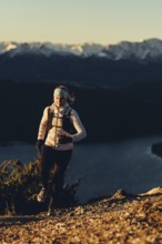 Trail running in autumn on the Jochberg on Lake Walchensee against the wonderful backdrop of the