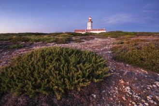 Lighthouse on Cabo Espichel cape Espichel on Atlantic ocean at dusk evening twilight. Sesimbra,