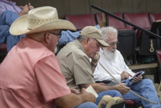 Oklahoma City, Oklahoma, Cattle buyers at an auction at the Oklahoma National Stockyards. Since it