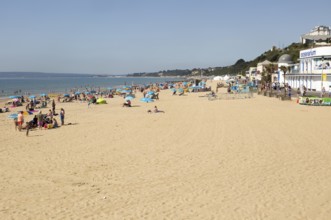 Holidaymakers on sandy beach near the Oceanarium, Bournemouth, Dorset, England, UK