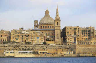 Soft evening light on buildings and churches Valletta, Malta, dome Basilica of Our Lady of Mount