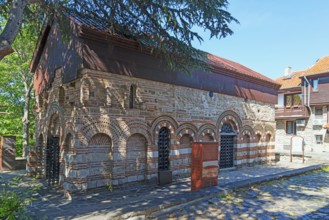 Old Byzantine church with red roof and brickwork on a sunny day, Church of St Paraskeva, Black Sea,