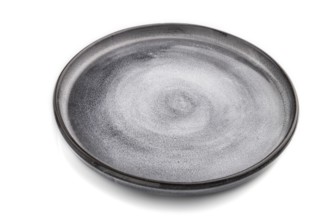 Empty gray ceramic plate isolated on white background. Side view, close up