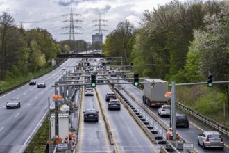 Weighing and barrier system on the A42 motorway, in front of the dilapidated motorway bridge over