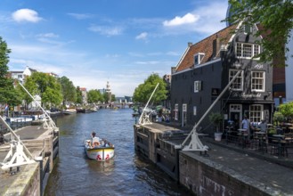 Sint Antoniesluis, on the Oudeschans canal, canal cruise boat, café, De Sluyswacht, Amsterdam,