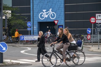 Cyclists on cycle paths, bicycle parking garage at the Fisketorvet shopping centre, Sydhavnen, in