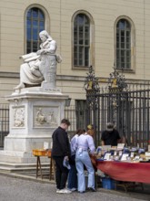 Tourists at the flea market stall in front of Humboldt University, Unter den Linden, Berlin,