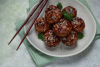 Tsukune, Japanese meatballs, minced chicken, fried on a skewer, with yakitori sauce, homemade, no