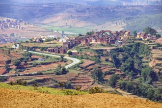 Terraced fields and two stories brick houses in Betsileo rural village in the Ambositra District,