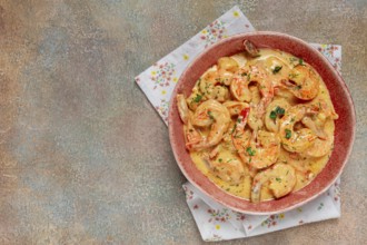 Shrimp in creamy garlic sauce, with spices and herbs