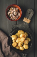 Fresh Cooked, new potatoes, with dill, on a wooden table, selective focus. close-up, toning, no