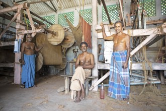 Indian worker in the weaving mill of the Labourers Coir Mats and Mattings Cooperation, coir mat