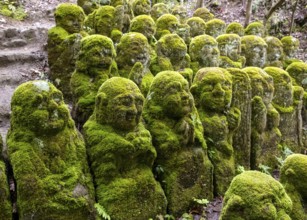 Moss-covered stone statues of rakans, the disciples of Buddha, Otagi Nenbutsu-ji temple, Kyoto,