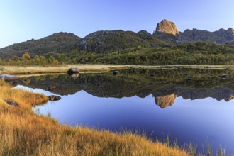 Mountain reflected in lake, autumn, morning light, sunny, Vesteralen, Norway, Europe