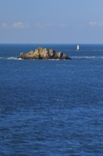 Evening view from the Pointe du Grouin with a view of the Phare de la Pierre-de-Herpin and striking