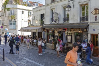 A lively café area in Montmartre, Paris with lots of people, Paris