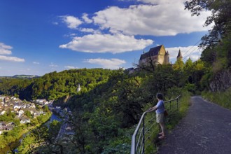 Elevated town view of Vianden with the river Our and the hilltop castle above the town, canton of