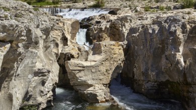 The cascades of Sautadet with limestone cliffs and the river Cèze in La Roque-sur-Cèze, Département