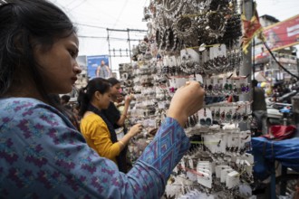 Women buys jewelleries at street market ahead of Durga Puja festival on October 7, 2024 in