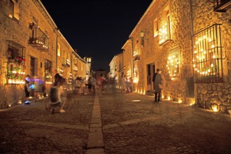 Calle Mayor at night, lit up with candles, Conciertos de las Velas festival of lights, Pedraza,