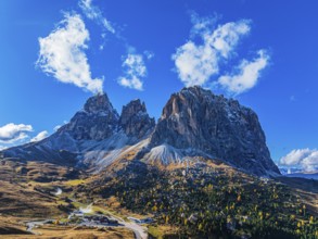 The peaks of the Sassolungo Group, Passo Sella, drone shot, Val Gardena, Dolomites, Autonomous