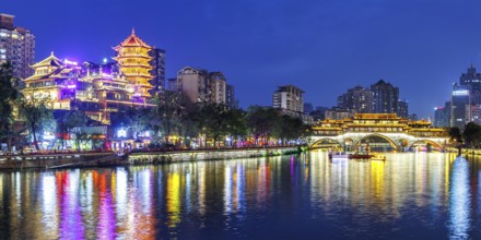 Chengdu Anshun Bridge over Jin River with pagoda at night panorama in Chengdu, China, Asia