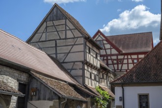 Half-timbered houses from the 15th century, in the historic fortified church, Hüttenheim, Lower