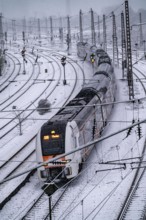 Winter weather, heavy snowfall, railway tracks in front of Essen main station, RE6, RRX, Rhine-Ruhr