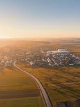 Aerial view of a village with long shadows of trees in golden hour, Obergaugstett, district Calw,