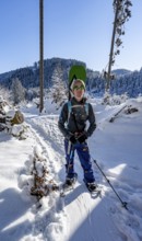 Snowshoers in a snowy winter forest, ascent to the Teufelstättkopf, Snowy mountain landscape,