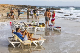 Bathers in front of the trendy beach bar Sa Trinxa on Salines beach, Ibiza, Balearic Islands,