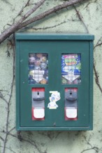 Chewing gum vending machine on a house wall, Kitzingen, Lower Franconia, Bavaria, Germany, Europe