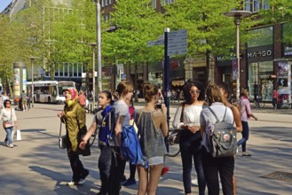 Germany, Hamburg, City, Mönckebergstraße, five young women in conversation, Europe