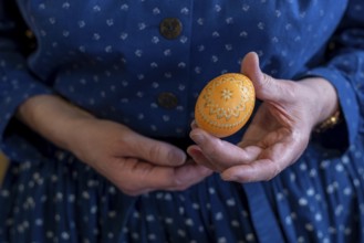 Hand holding a decorated Easter egg, Sorbian Easter egg, Germany, Europe