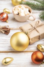 Christmas or New Year composition. Decorations, box, golden balls, cinnamon, fir and spruce