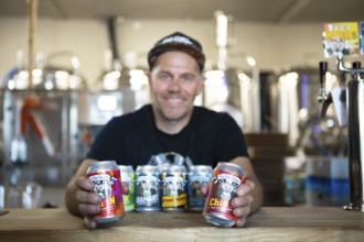 Pontus Henryz, owner of the brewery Två Feta Grisar, shows his beer brewed in Gothenburg, Ringön,