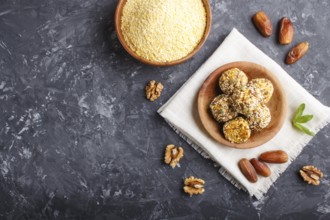 Energy ball cakes with dried apricots, sesame, cornflakes, linen, walnuts and dates with green mint