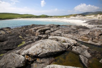 Rocky headland and sandy beach at Bagh a Deas, South Bay, Vatersay island, Barra, Outer Hebrides,