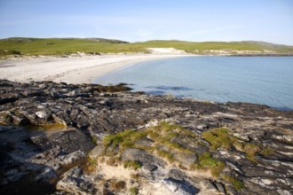 Rocky headland and sandy beach at Bagh a Deas, South Bay, Vatersay island, Barra, Outer Hebrides,