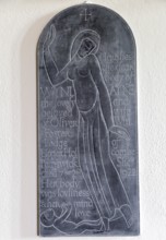 Eric Gill engraved slate memorial tablet in village parish church of Saint Michael, Wilsford cum