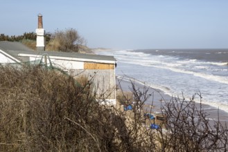 March 2018, Clifftop property collapsing due to coastal erosion after recent storm force winds,