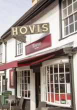 Old fashioned traditional Hovis bread sign above Reeve bakery shop, Amesbury, Wiltshire, England,