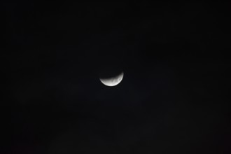 The moon with a partial lunar eclipse, taken in the Swiss mountains, Switzerland, Europe