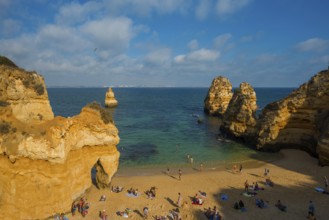 Rocky coast with beach and red rocks, Praia do Camilo, Lagos, Algarve, Portugal, Europe