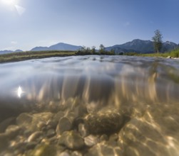 Underwater photograph of a river in front of mountains in sunlight, summer, Loisach, Schlehdorf,