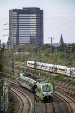 Tracks in front of Essen main station, ICE 2 train on the tracks, S-Bahn train, town hall, North