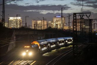 Skyline of Essen city centre, railway facilities in front of the main station, regional train,