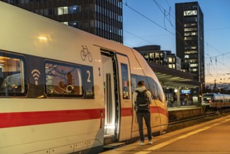 Railway station, ICE train on platform, skyline of Essen city centre, North Rhine-Westphalia,