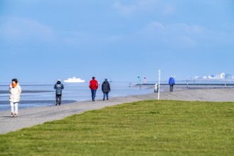 Dyke walk on the East Frisian coast near Norddeich, in the background the island of Norderney,